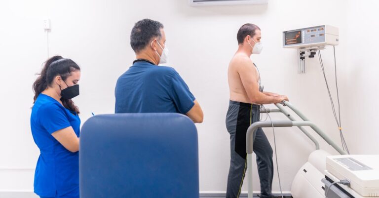 Patient undergoing a cardiac stress test in a medical clinic with a healthcare team.